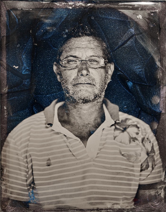 Marcin Gierat, Portrait of Massimiliano Schiavon, CEO Schiavon Art Team, 2019. Wet Collodion photography on Murano glass "Avventurina". 21.5x27.5 cm. Courtesy of the artist and Zuecca Projects, Venice